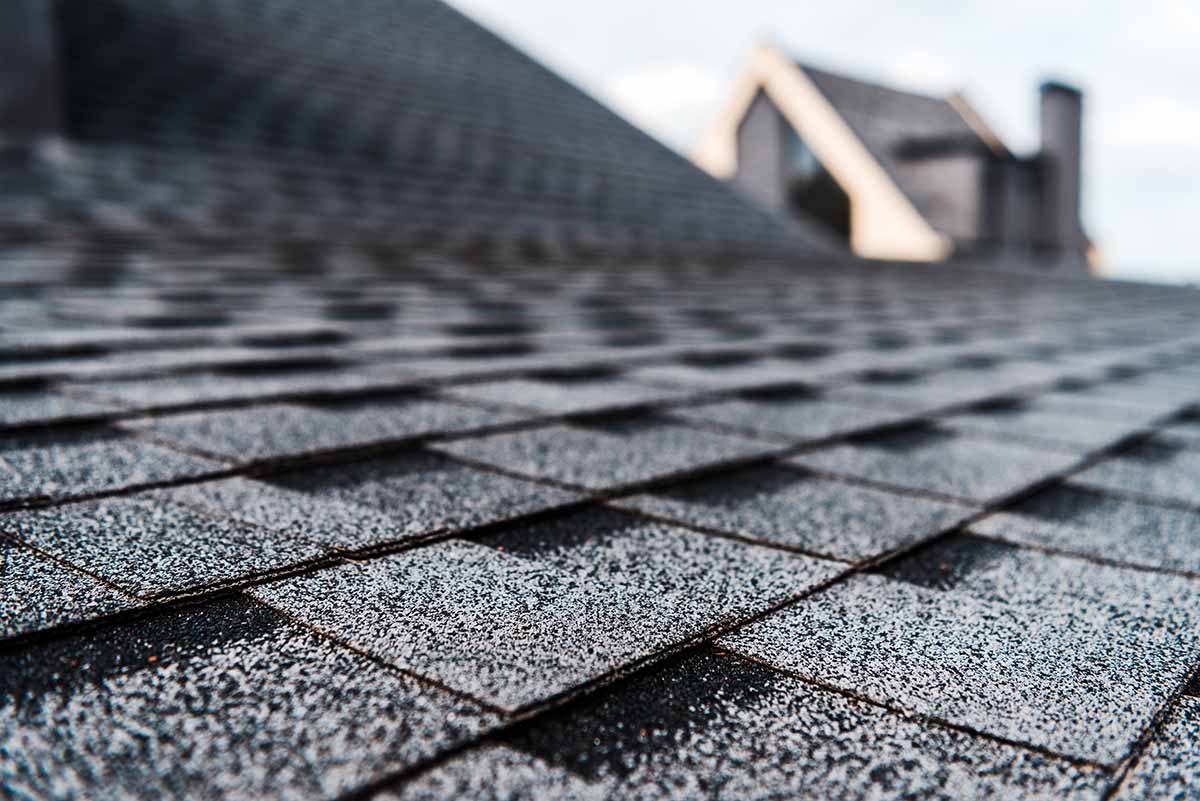 Close inspection of architectural shingles on a Maryland roof